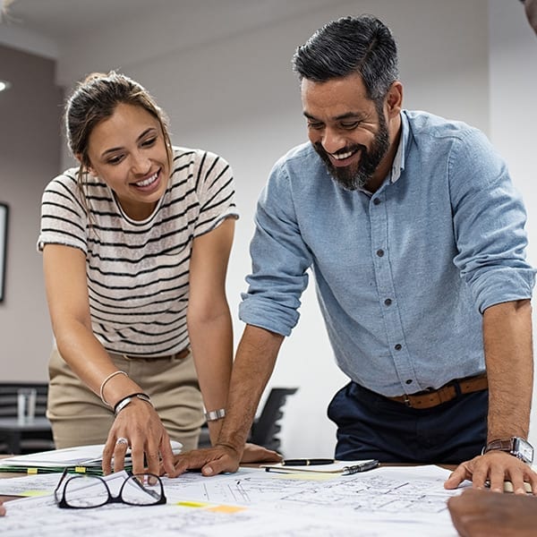 Employees Discussing Construction Plans